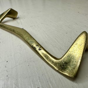 May include: A rustic wooden sign with the text "Welcome to our porch" in white lettering. The sign features a distressed finish and a simple, inviting design, perfect for outdoor decor.