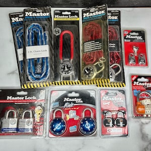 May include: Assortment of Master Lock combination and chain locks in various colors and sizes, including a 3 ft. chain lock, a padlock with a red shackle, and a mini lock with a blue dial. The packaging features the Master Lock logo and product descriptions.