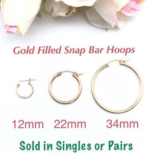 May include: Three gold-filled snap bar hoop earrings in different sizes: 12mm, 22mm, and 34mm.  Sold in singles or pairs.