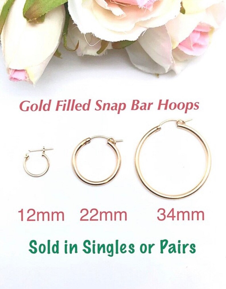 May include: Three gold-filled snap bar hoop earrings in different sizes: 12mm, 22mm, and 34mm.  Sold in singles or pairs.