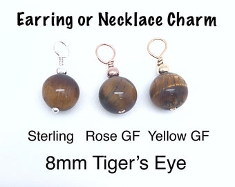 May include: Three tiger's eye gemstone charms, each with a different metal finish: sterling silver, rose gold-filled, and yellow gold-filled. The charms are 8mm in size and can be used as earrings or necklace pendants. Text on the image reads: "Earring or Necklace Charm".