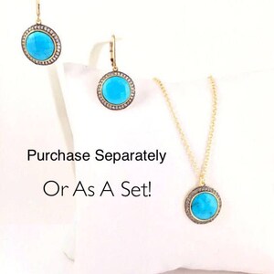 May include: A turquoise and gold necklace, earrings, and pendant set with a round turquoise stone surrounded by small diamonds. Purchase Separately Or As A Set!