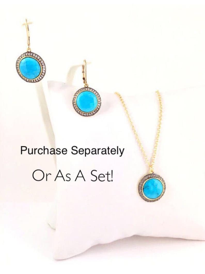 May include: A turquoise and gold necklace, earrings, and pendant set with a round turquoise stone surrounded by small diamonds. Purchase Separately Or As A Set!