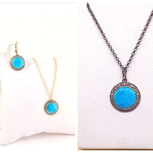 May include: A turquoise gemstone pendant necklace with a silver chain and a matching pair of earrings. The pendant and earrings are surrounded by a halo of small diamonds.