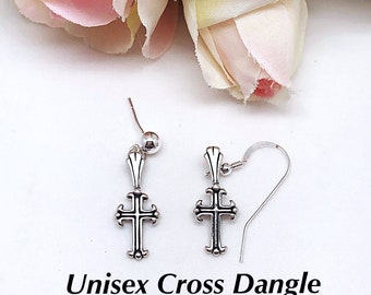May include: A pair of silver cross dangle earrings. The earrings are made of sterling silver and have a simple, elegant design.