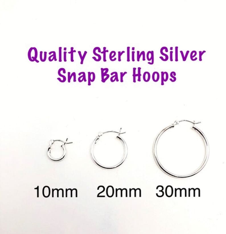 May include: Three silver hoop earrings with snap bar closures. The hoops are 10mm, 20mm, and 30mm in diameter.
