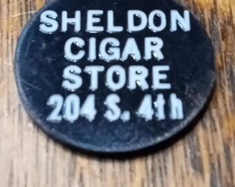 Sheldon Cigar Store 204 S. 4th Good For 2 1/2 In Trade 7/8" Black Plastic