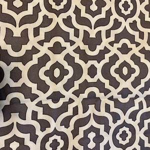 May include: A white and dark gray geometric pattern fabric with a repeating design of interlocking shapes.