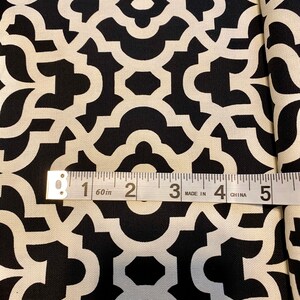 May include: Black and white fabric with a geometric pattern. A measuring tape reads "60 in" and shows 5 inches.