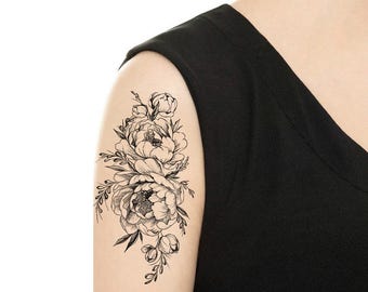 May include: A black and white floral tattoo design featuring a bouquet of peonies with intricate details.
