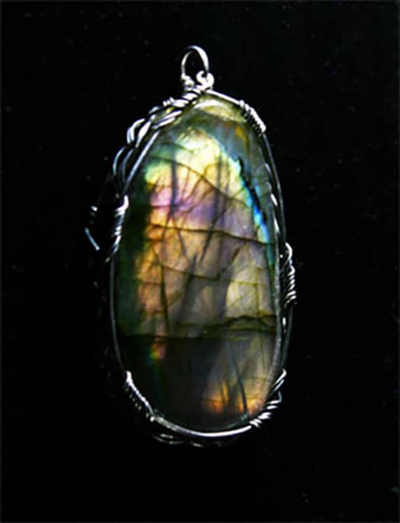 Labradorite pendant wrapped in a sterling silver Celtic design