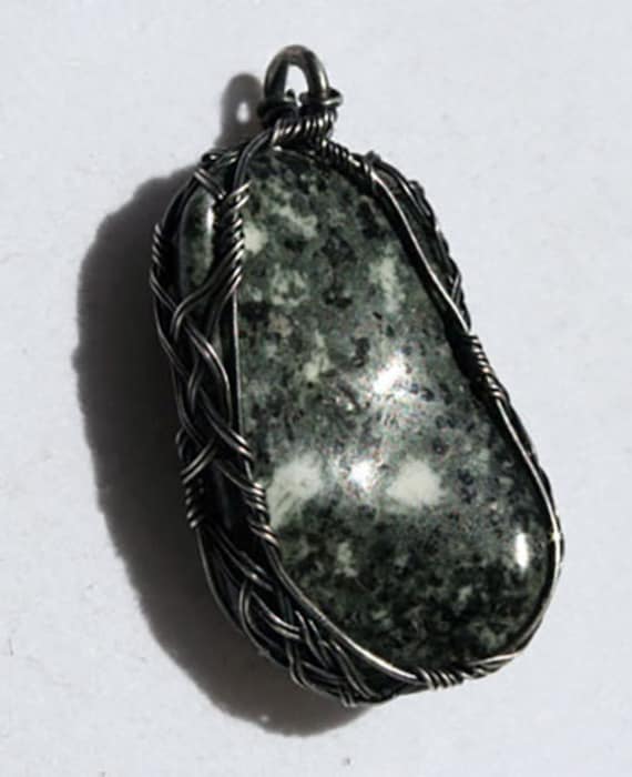 Preseli blue stone wrapped in a Celtic style with oxidized silver