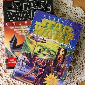 Pair of Star Wars books, A Guide To The Star Wars Universe and The Empire Strikes Back