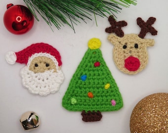 May include: Crocheted Christmas decorations featuring Santa Claus, a Christmas tree, and a reindeer. The decorations are made with white, red, green, brown, and yellow yarn.
