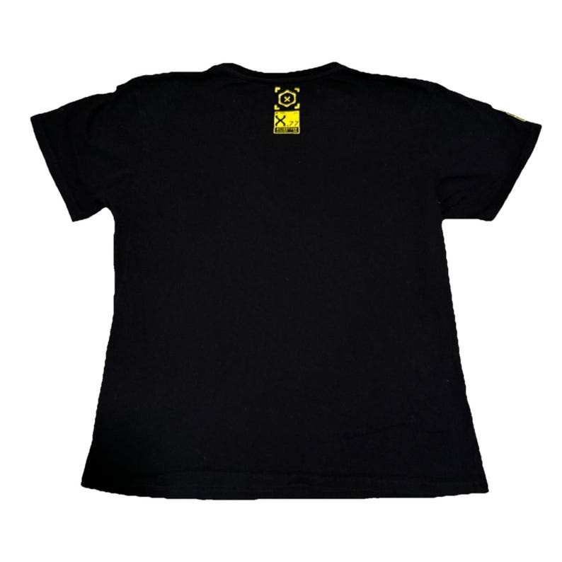 May include: Black t-shirt with a yellow graphic on the upper back. The graphic includes a square with an "X" inside a circle, and the text "X.77". The shirt is made of a soft material and has short sleeves.