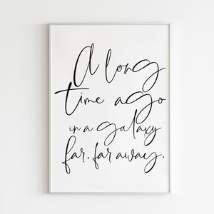 May include: A black and white printable wall art print with the text "A long time ago in a galaxy far, far away."