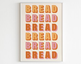 Puede incluir: Una impresión enmarcada con la palabra "BREAD" repetida seis veces en un diseño vertical apilado. La palabra está en una fuente de estilo retro con un efecto 3D. Los colores son naranja, rosa y blanco.