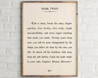 May include: A vintage-style print featuring a quote by Mark Twain. The quote reads: "Life is short, break the rules, forgive quickly, kiss slowly, love truly, laugh uncontrollably, and never regret anything that made you smile. Twenty years from now, you will be more disappointed by the things you didn't do than by the ones you did. So throw off the bowlines. Sail away from the safe harbour. Catch the trade winds in your sails. Explore. Dream. Discover." The print is on a cream-coloured background with black text and a black border.