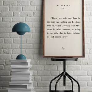 May include: A framed print with a white background and black text. The text is a quote by the Dalai Lama: "There are only two days in the year that nothing can be done. One is called yesterday and the other is called tomorrow, so today is the right day to love, believe, do and mostly live." The number 37 is printed below the quote.