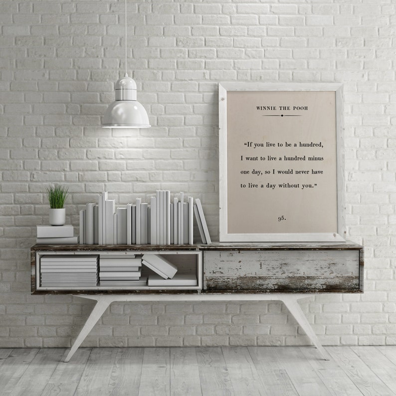 White-colored room with framed Winne the Pooh quote