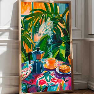 May include: A painting of a still life with a coffee pot, a cup of coffee, and a pastry on a colorful tablecloth. The coffee pot is blue and has a silver lid. The cup of coffee is orange and has a white saucer. The pastry is brown and has a white glaze. The tablecloth is covered in a floral pattern with pink, blue, green, and yellow flowers. The background is a window with green plants.