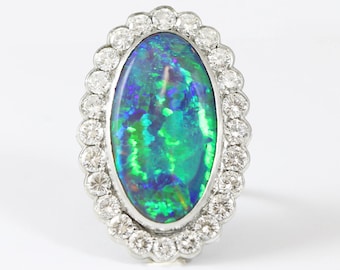 Opal and diamond handmade halo ring in platinum stunning unique oval one of a kind