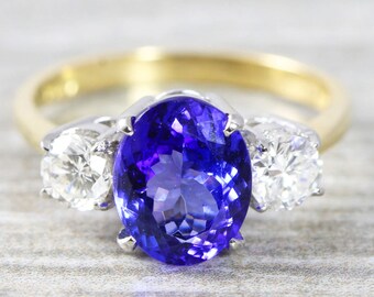 Oval Tanzanite and diamond 3 stone trilogy engagement ring handmade in 18 carat gold