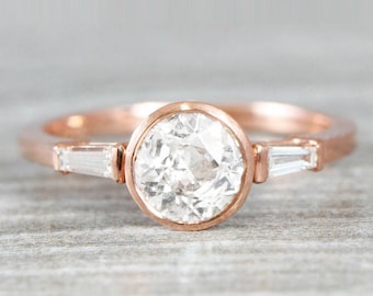 1 carat diamond solitaire engagement ring handmade in rose gold with baguette accent stones