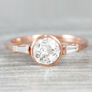 1 carat diamond solitaire engagement ring handmade in rose gold with baguette accent stones