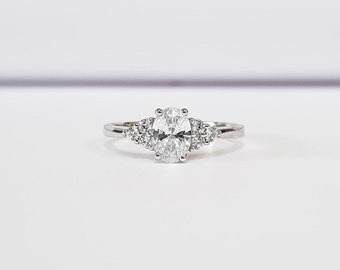 Moissanite and Diamond Oval Engagement Ring