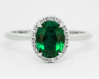 Emerald and diamond halo engagement ring in rose/white/yellow gold or platinum