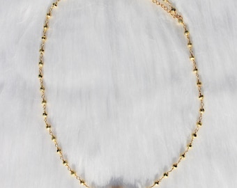 Collana con chiusura a moschettone e perline in oro galattico