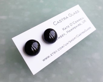 Sparkly stud earrings in very dark green for pierced ears.