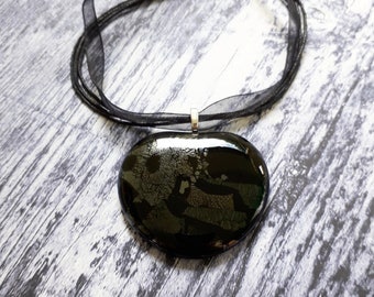 Black heart pendant, made from black, gold, bronze and pewter iridescent cast glass