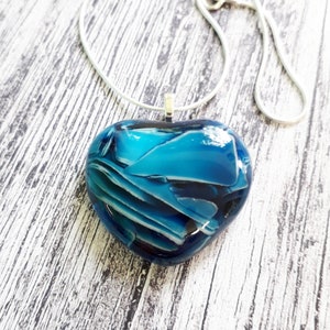 Heart pendant in blue and white cast glass.