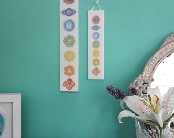 Chakra design wall plaque, white glass, rainbow coloured decorative hanging with the seven chakras
