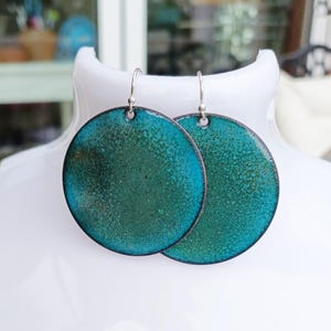 Enamel copper earrings in blue and green, on sterling silver ear wires.