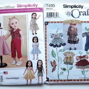 May include: Two Simplicity sewing pattern envelopes for 18-inch doll clothes. The left envelope, 1086, displays various outfits including a red pant set and dresses. The right envelope, 7490, titled Just Be 'Cuz, features illustrations of dresses and overalls.