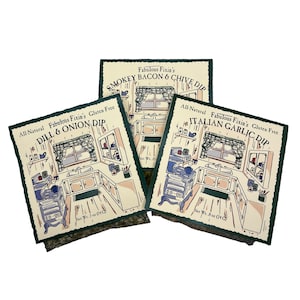 May include: Three packages of gluten-free dip mixes. The packages are green and white with a cartoon kitchen scene. The flavors are Smokey Bacon & Chive Dip, Dill & Onion Dip, and Italian Garlic Dip. The packages are labeled with the net weight of 5 oz (140 g) and 8 oz (240 g).