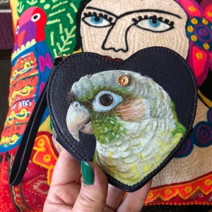 Handpainted wristlet with a green cheek conure