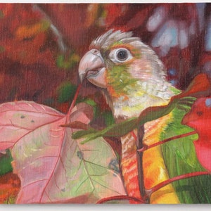 May include: A green and yellow parakeet with red and orange feathers perched on a branch with red and green leaves. The parakeet is looking to the left of the image.