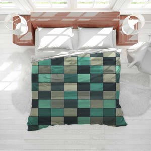 May include: A top-down view of a bed with a teal and gray checkered comforter. The bed has white pillows and a wooden headboard. Two white lamps are on either side of the bed, and the floor is white.