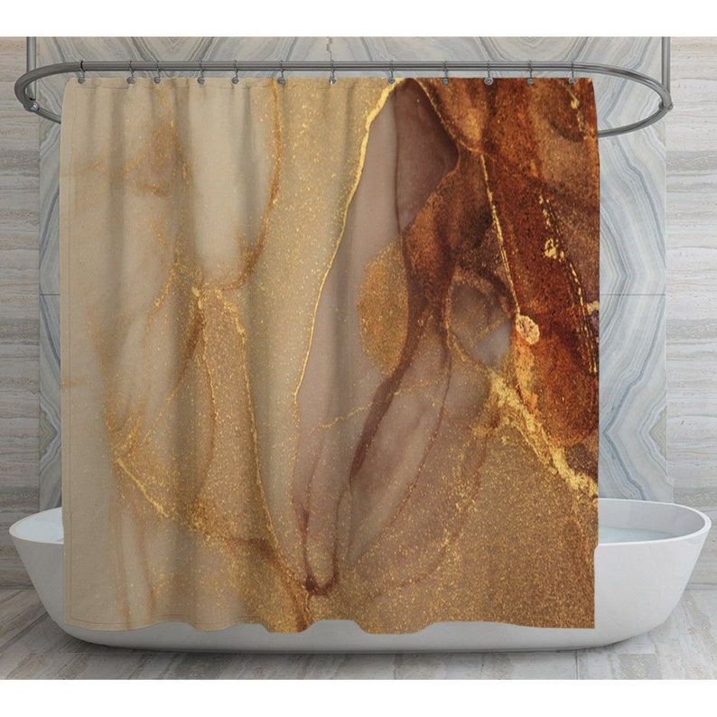 May include: Abstract shower curtain with a brown and gold marble pattern.