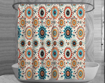 May include: A shower curtain with a repeating pattern of stylized floral designs in orange, teal, and navy blue on an off-white background. The curtain is hanging in front of a white bathtub.