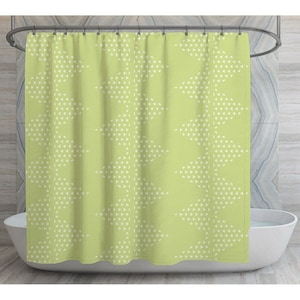 May include: A green shower curtain with a white geometric pattern of triangles. The pattern is repeated throughout the curtain.