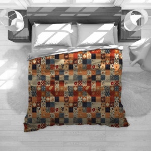 May include: A patchwork quilt with a vintage aesthetic, featuring a grid of squares in various colors and patterns. The quilt showcases floral and geometric designs in shades of red, blue, orange, and beige. The quilt is on a bed with white pillows and a gray comforter.