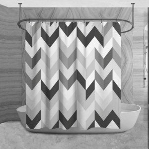 May include: A black and white chevron patterned shower curtain. The curtain is made of a soft, water-resistant fabric and is perfect for adding a modern touch to any bathroom.