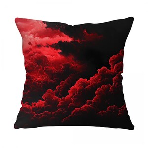 May include: Square decorative pillow featuring a dramatic cloudscape design. The pillow showcases a vibrant red and black color palette, with swirling cloud formations. The design creates a moody and atmospheric aesthetic, suitable for home decor.