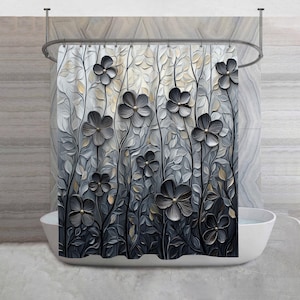 May include: A gray and black floral shower curtain with a 3D effect. The curtain features stylized flowers and leaves against a textured background. The flowers have gold-colored centers and are arranged on dark gray stems.