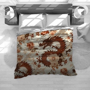 May include: A white duvet cover with a red and brown dragon and floral pattern. The dragon is curled around a large flower.